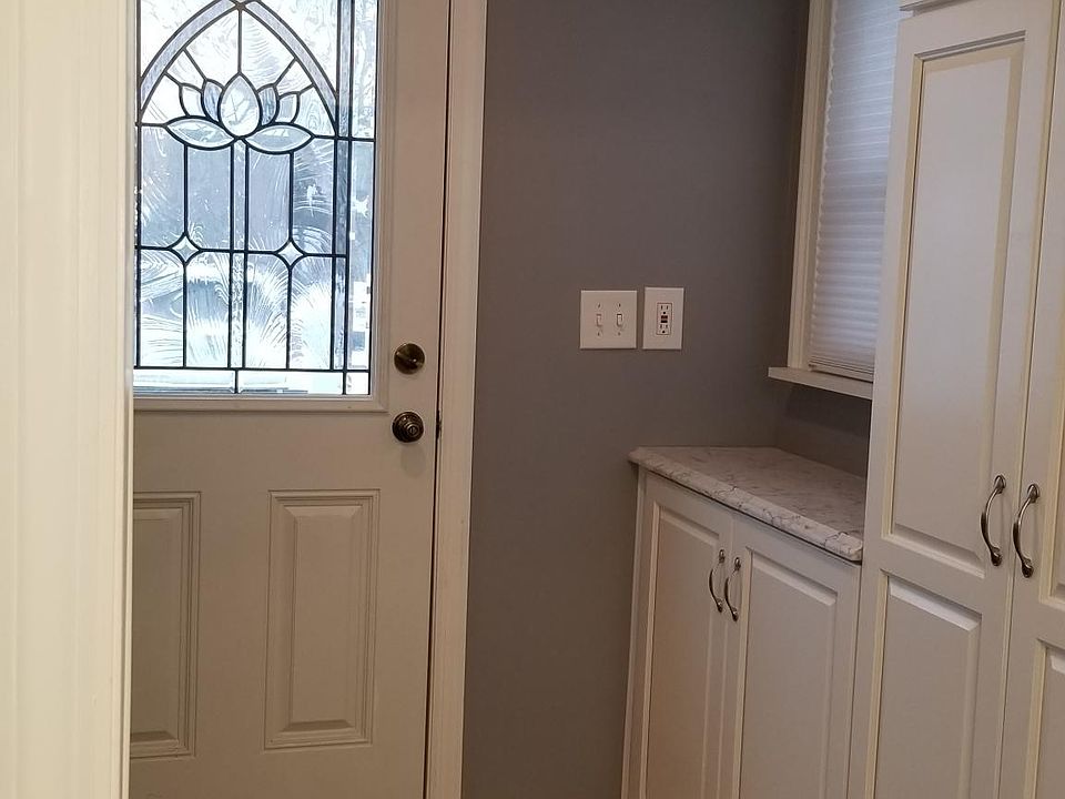 Interior side of main entry with new doors, floor, and more!