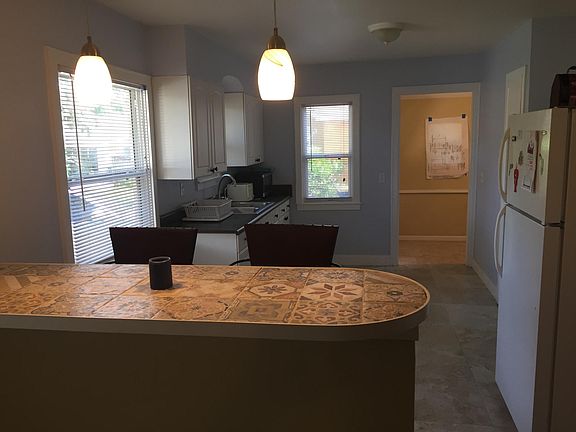 View of kitchen and breakfast bar from the living room.