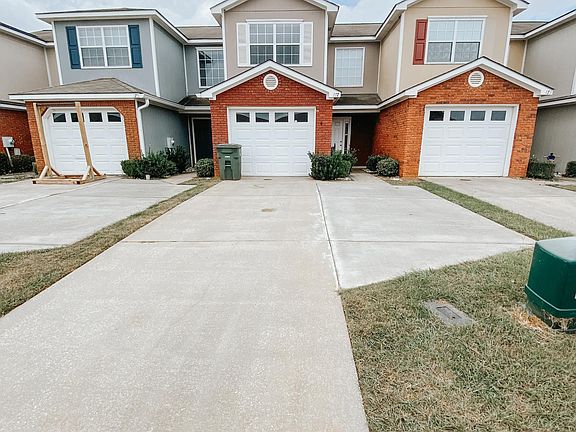 Street view. single car garage with extra parking