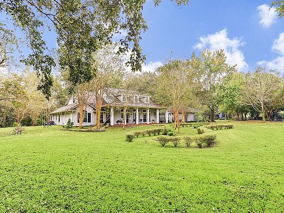 This lovely home sits on 1.5 park like acres and has porches on the front and back to enjoy the views.