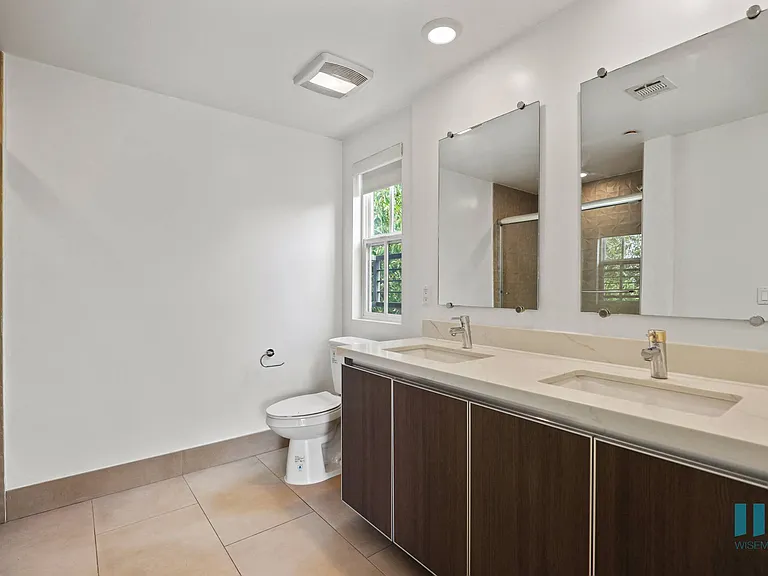 Bathroom with Double-Sink Vanity and Shower Bath with Glass Door