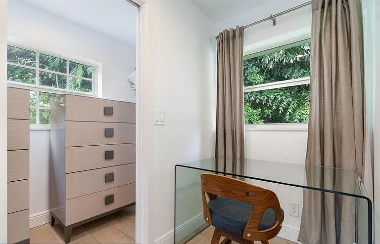 Master bedroom desk space and entry to walk-in closet