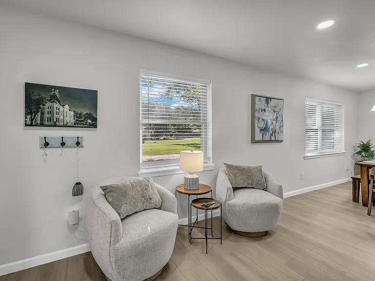 Comfy chairs with a view of everything happening in the living room, kitchen, dining and even out the sliding doors to watch the geese play!