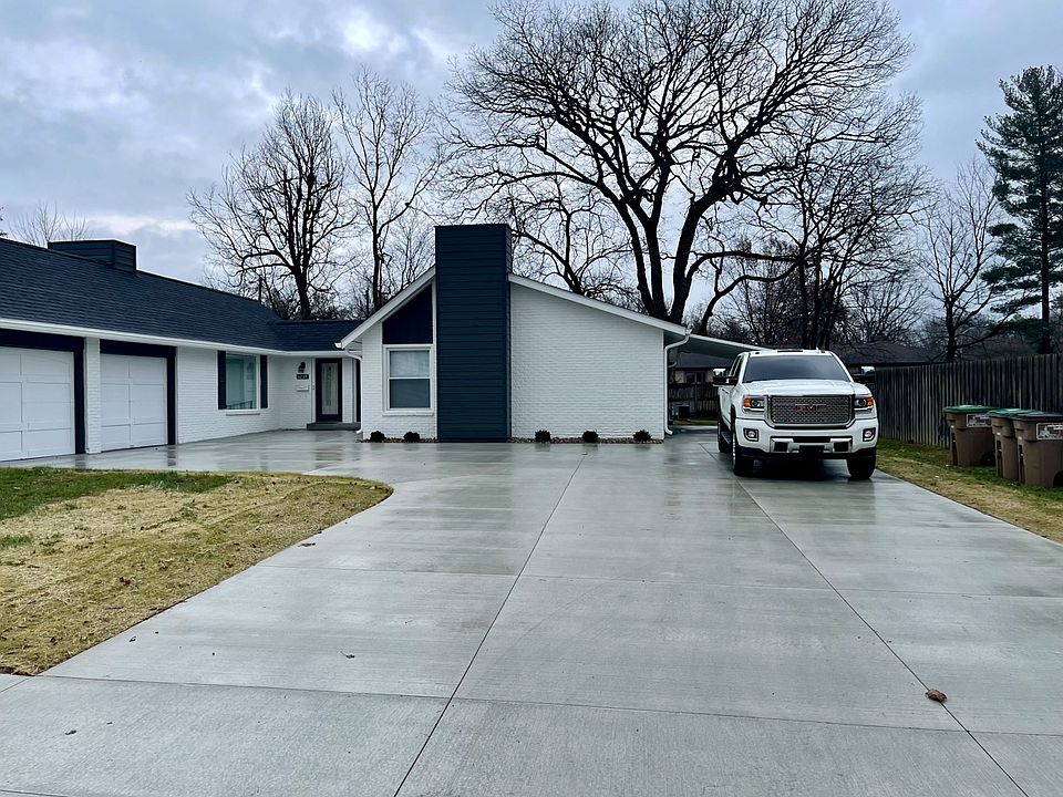 New concrete drive, new roof, detached one car garage and attached carport at side entrance.