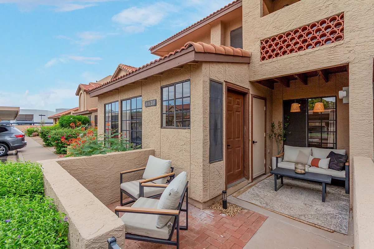 Front door with outdoor living space. (2) designated covered parking spaces right in front of unit. - 8625 E Belleview Pl
