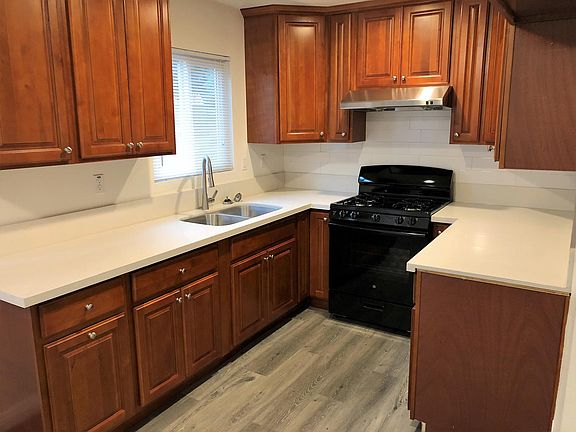 This kitchen has plenty cabinet storage and abundant counter-top space.