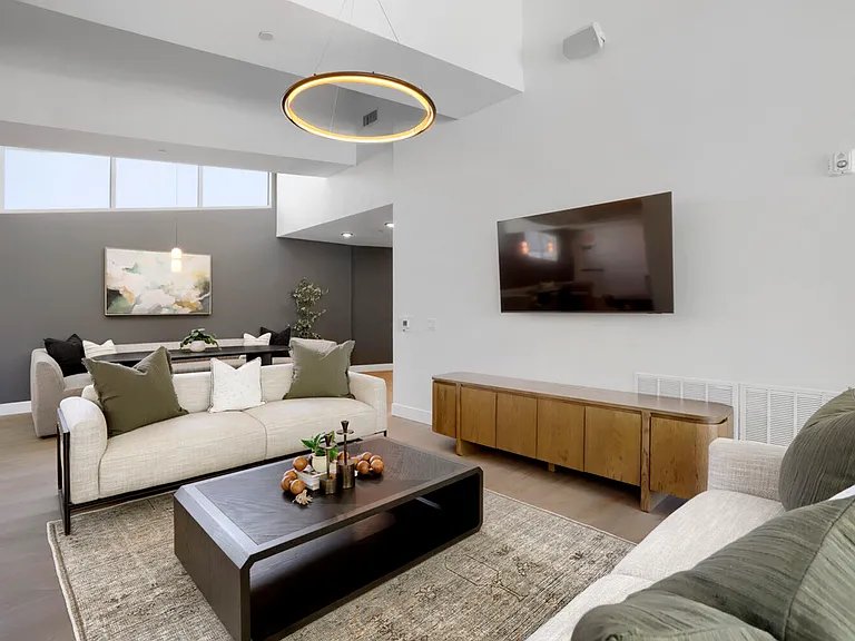 Garrett Uptown's two-story clubhouse includes a second resident's lounge with cozy sofas and a flat-screen TV.
