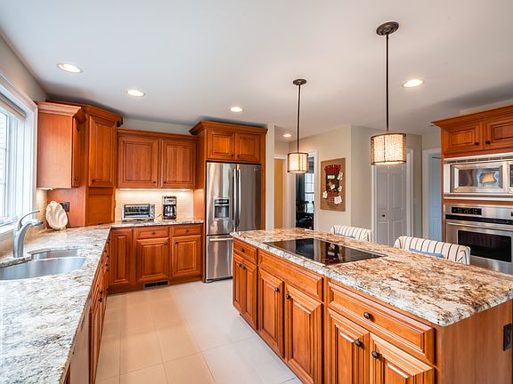 Granite Center Island in Luxury Kitchen