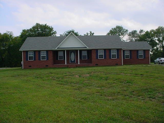 before trees and landscaping