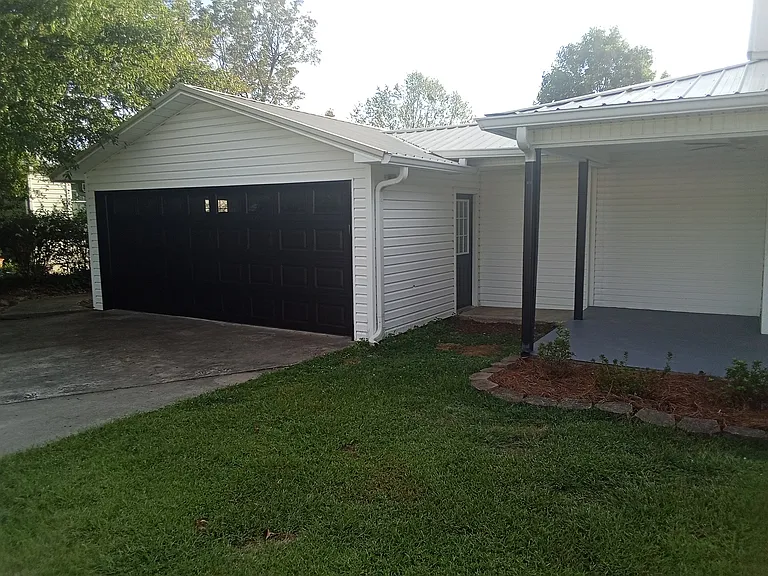 2 car garage with 2 remotes. Side door leads to front porch. Back door on garage leads to back deck and back door of house.