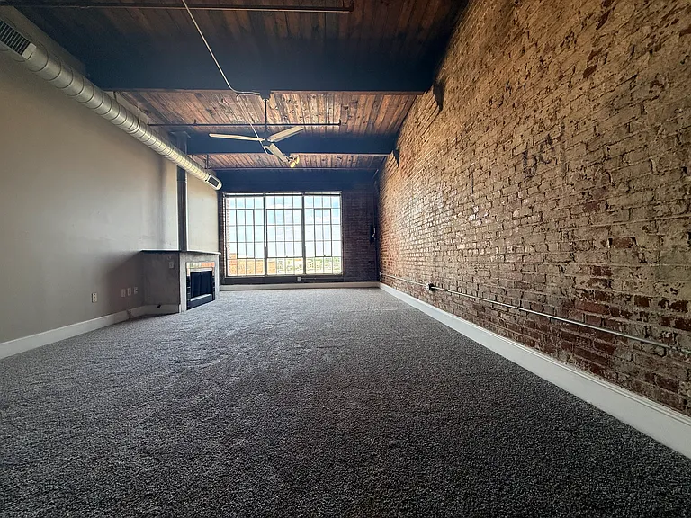 Dining and living room space. Gas fireplace.