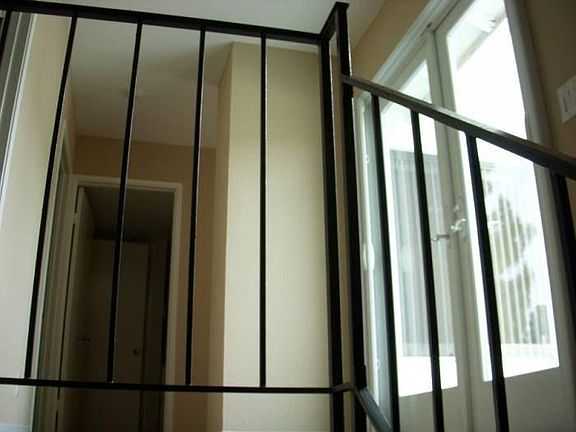 French Doors leading to the balcony at the top of the stairs