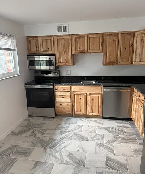 KITCHEN WITH ALL NEW STAINLESS STEEL APPLIANCES