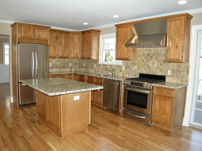 Kitchen with Granite Countertops and Tumbled Marble Backsplash, SS Appliances
