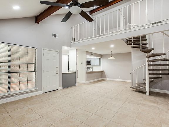 Living room with view of upstairs loft