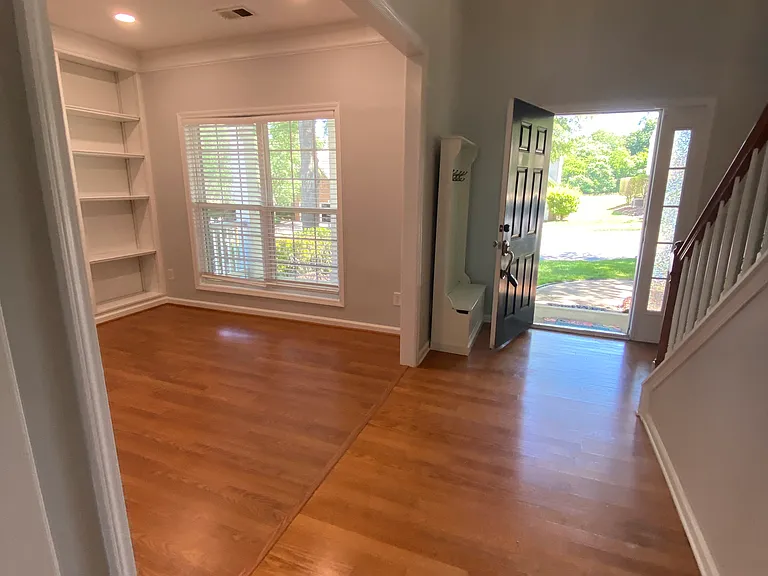 This home features an open floor plan with high ceilings. As you enter you will pass by the office/library/study to your right...