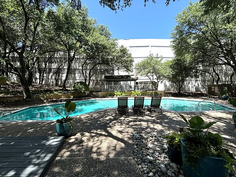 Pool view with loungers and table and chairs to the west. A great area even on hot days!