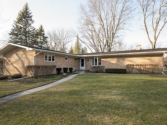 Lush landscape design and a cozy sidewalk access path surround this beautiful home with an underground sprinkler system, deck, patio and more. Inside, Pella windows with roll up screens offer a lovely view of this space.