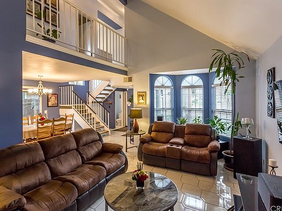 Open to the dining and the upstairs hall. Warm, in
