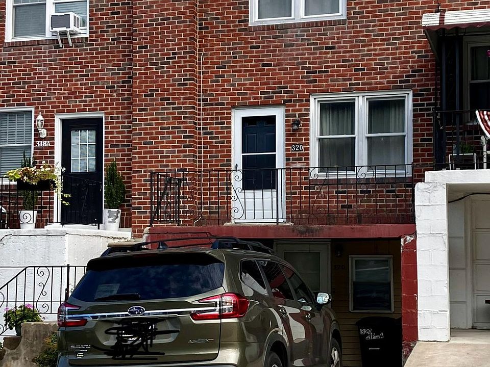 Front w/porch and driveway