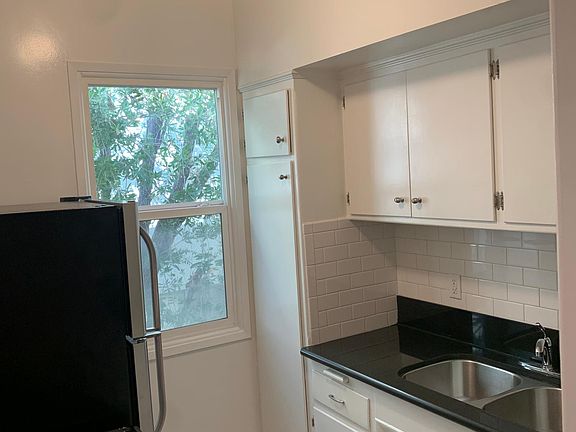 stone counters, designer tile floors. stainless steel appliances. natural light