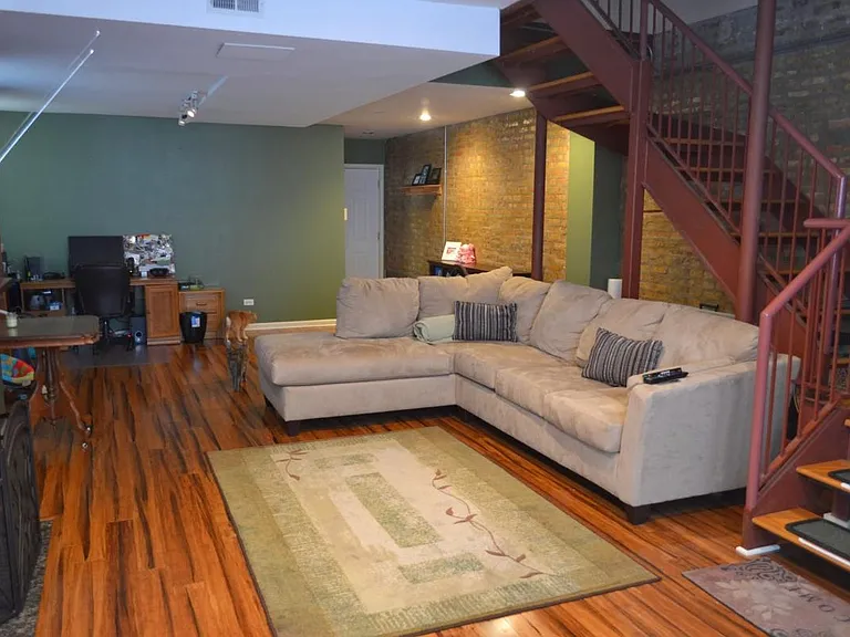 Huge living room with exposed brick