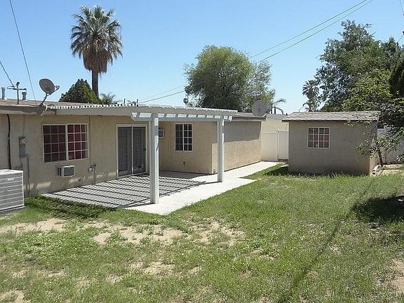 Rear with Covered Patio and Storage Shed