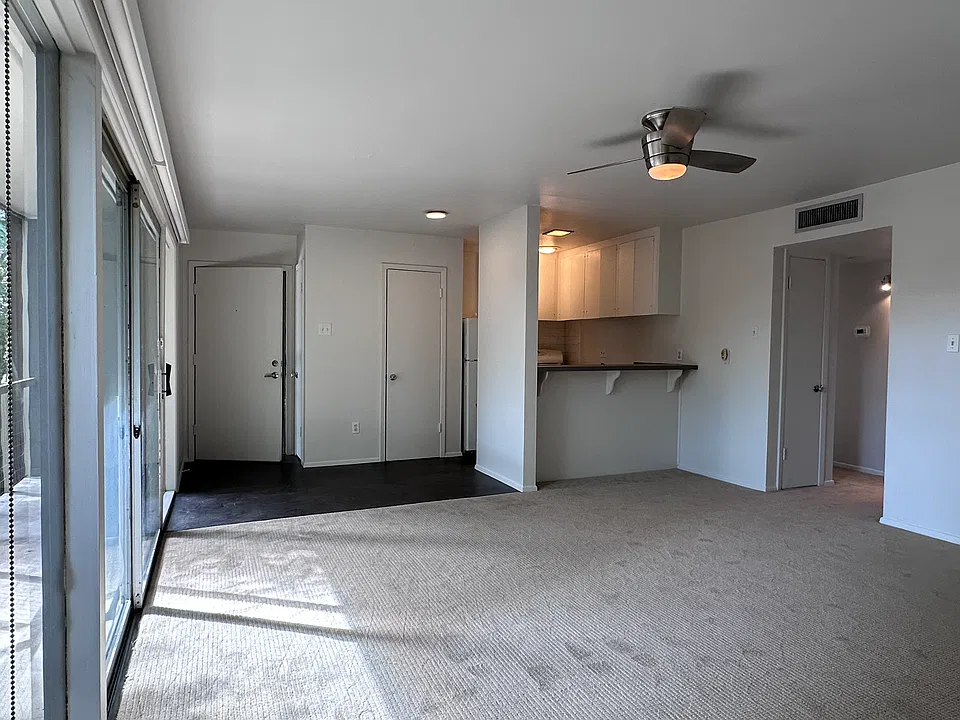Living and dining is one large space and the balcony is the full width of the unit.