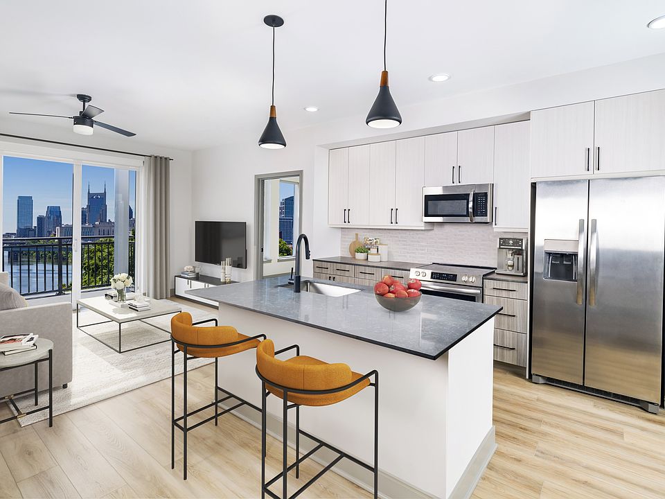 Embark on sophistication at Modera Riverview, Nashville TN. Gourmet kitchens showcase quartz countertops, 42-inch bespoke cabinetry, under-cabinet illumination, and an expansive chef's island with integrated storage.