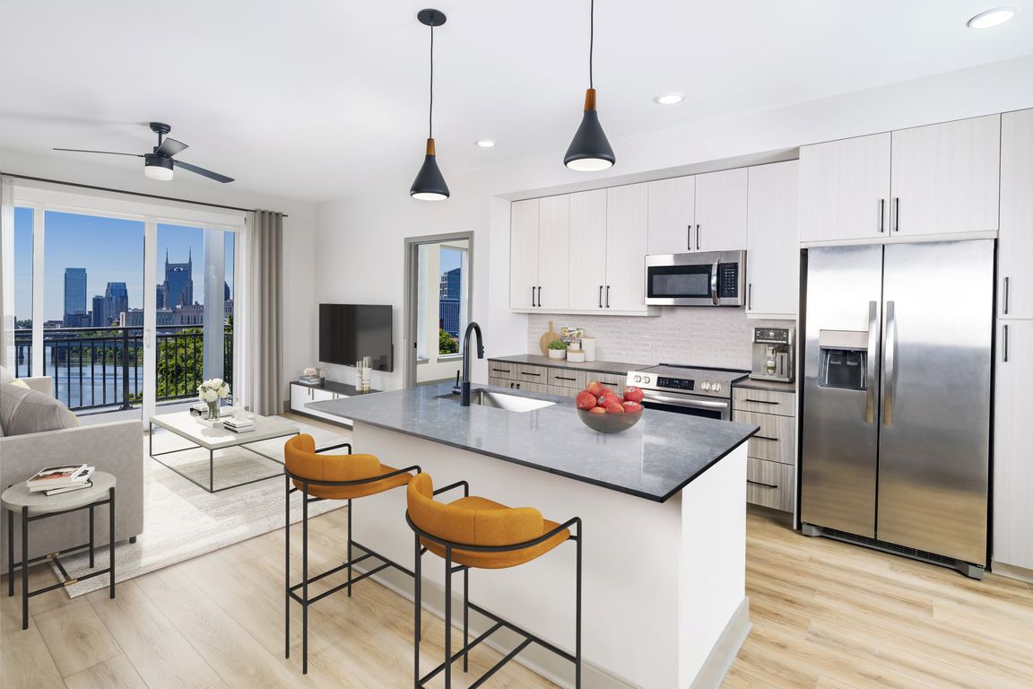 Embark on sophistication at Modera Riverview, Nashville TN. Gourmet kitchens showcase quartz countertops, 42-inch bespoke cabinetry, under-cabinet illumination, and an expansive chef's island with integrated storage.