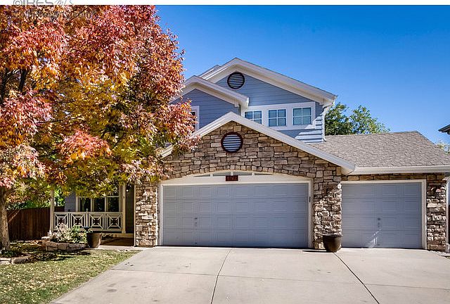 3-car garage and mature trees.