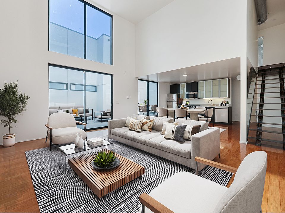 Open-Concept Living and Kitchen Area Leading to a Private Enclosed Patio