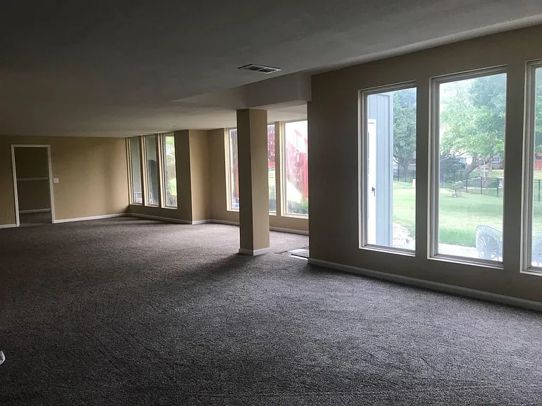 Basement, in the view, the door shows a bed room with window that is not open window.