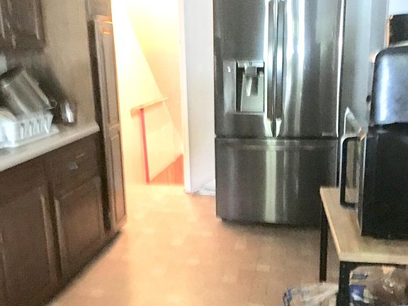 Good cabinet space and a brand new LG refrigerator with ice and water dispenser! The steps lead down into the finished basement and laundry areas.