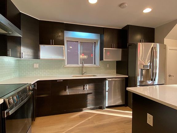 This is the kitchen. Kitchen and island countertops are quartz.