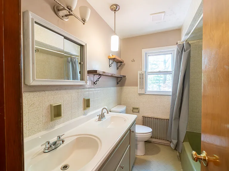 guest bathroom has double sink