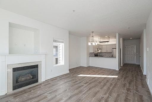 Main floor with living area, dining area, kitchen, and front