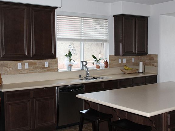 The Kitchen looks out to the backyard. 