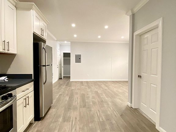 Large Functional Kitchen Opens to Living Room, LED Recessed Lighting