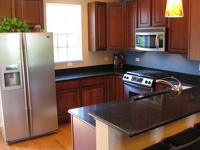 Kitchen - SS / Quartz / Cherry Cab./ Oak Flr