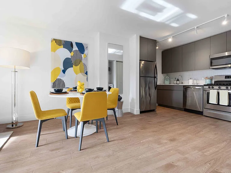 Lacquered matte cabinetry and stainless steel appliances