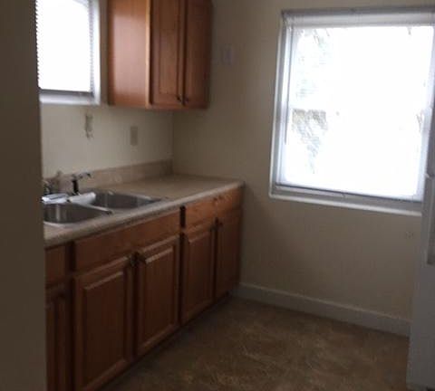 Kitchen with stove and refrigerator.