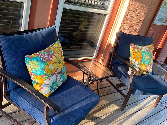 Outdoor seating on the front porch for you.