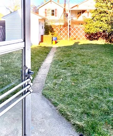 Back door to fenced backyard