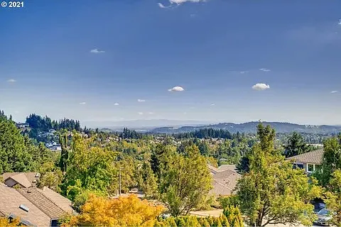 View of the Cascades (and the very top of Mt Hood) from deck