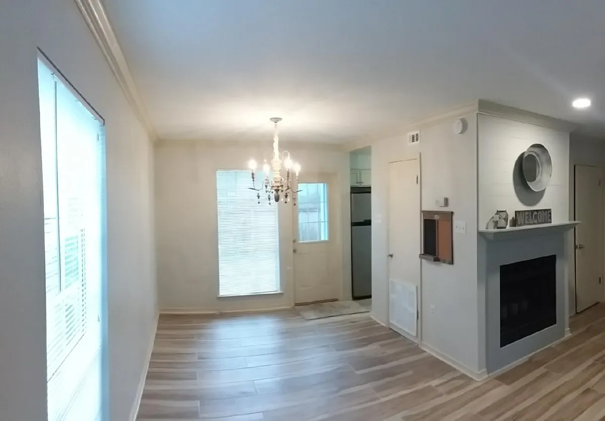 Dining area with wooden chandelier off of kitchen. - 506 Cedarwood Dr