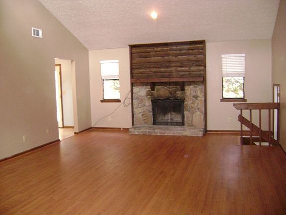 Great Roomw new harwwod floors,vaulted ceilings, and masonary fireplace!