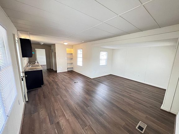Living room, eat-in kitchen. New floors, lighting, windows.