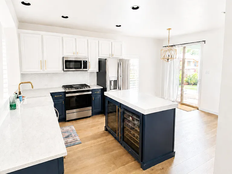 Kitchen with upgraded stainless steel appliances and marble countertops - 2 wine / beverage fridges