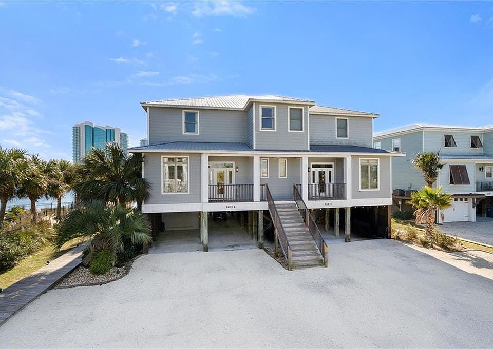 Coastal home featuring french doors and a carport